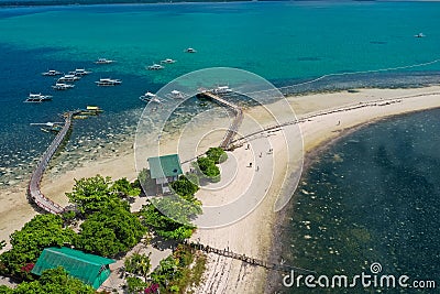 Tropical sea coast-Islands with white sand, local huts, palm trees. Aerial view from the drone Stock Photo