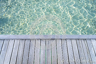 Tropical seascape with wooden platform on the turquoise ocean. Stock Photo