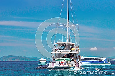 Tropical seascape with yacht and speedboat over beautiful mountains background, luxury summer adventure, active vacation in sea. Editorial Stock Photo