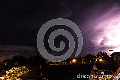 Tropical Storm clouds and Lightning at night on Bali island, Indonesia. Stock Photo