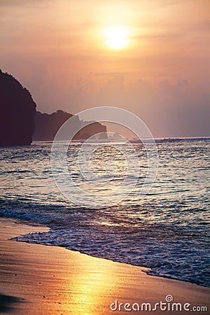 Tropical sunset beach background, seashore line and waves Stock Photo