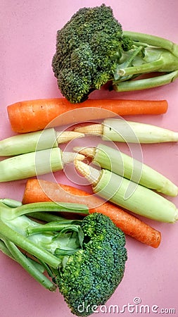 Tropical vegetables consist of green broccoli, baby corn and carrots Stock Photo