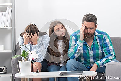 Trouble couple with unhappy child teenager discussing problems in worry family. Conflicts marital sad couple with kids Stock Photo