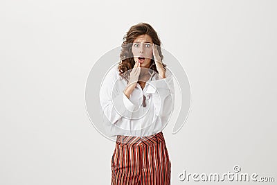 Troubled woman scared of consequences. Portrait of stylish rich caucasian female expressing astonishment and shock Stock Photo