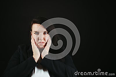 Troubled worried shocked woman at empty background Stock Photo