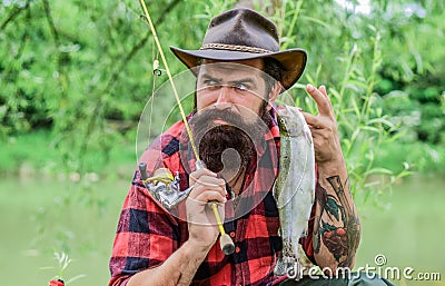 Trout catch. sport activity and hobby. experienced fisher in forest. Successful fishing. summer weekend. man with great Stock Photo