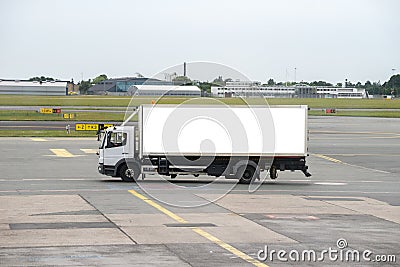 Truck on airport runway Stock Photo