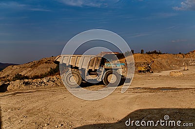 truck bulldozer sand construction work outdoors blue sky summer Stock Photo