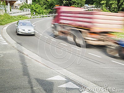 Truck and car in the curve Stock Photo