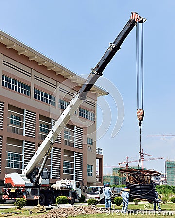 Truck crane at construction site Stock Photo