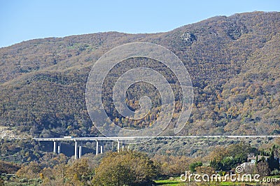 Truck crossing Ambroz Valley through Autovia A-66 bridge Stock Photo