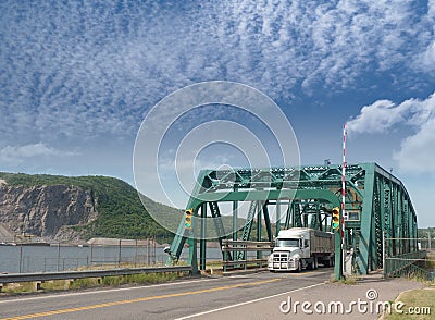 Truck crossing iron bridge Stock Photo