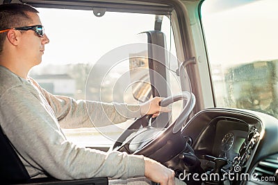 Truck driver in the cab Stock Photo