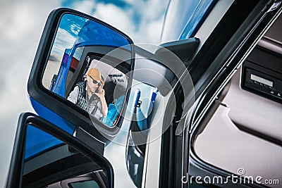 Truck Driver in the Mirror Stock Photo