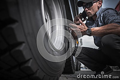 Truck Driver Ordering New Wheels Stock Photo