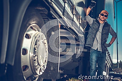 Truck Driver Between Trailers Stock Photo