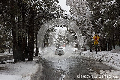 Truck Driving Through Flooded Road During Warm Winter Storm Near Lake Tahoe Stock Photo