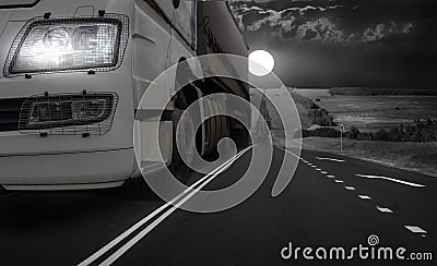 Truck Driving Night on a Country Highway Stock Photo