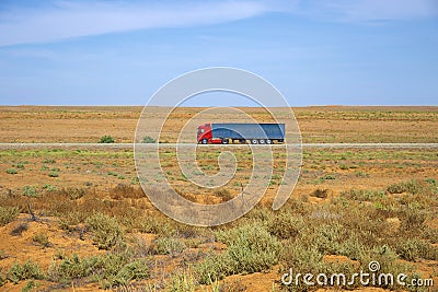 The truck is driving through the steppes of Kalmykia Stock Photo