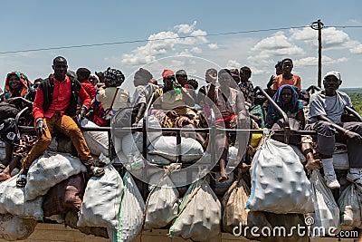 Truck full of passengers and goods at rush hour. Editorial Stock Photo