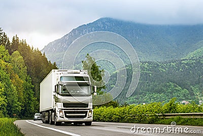 Truck on highway in the highlands Stock Photo