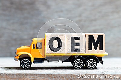 Truck hold block in word OEM Abbbreviation of Original Equipment Manufacturer on wood background Stock Photo