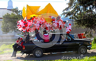 Truck with many Santa claus balloons Editorial Stock Photo