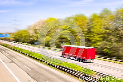 Truck moves on the road at speed, Stock Photo