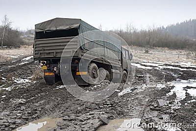 Truck on the muddy road Stock Photo