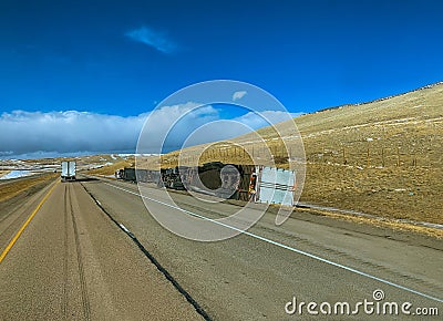 Truck overturned vehicles are destroyed on highway after a blizzard winter Stock Photo