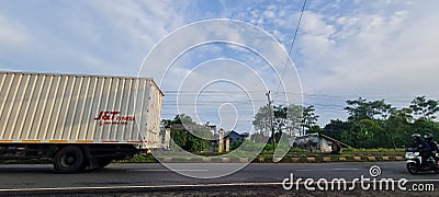 The truck passes through the highway Editorial Stock Photo