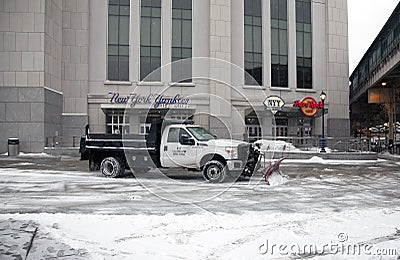 Truck with plow clears snow Editorial Stock Photo