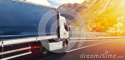 Truck run fast on the highway to deliver Stock Photo