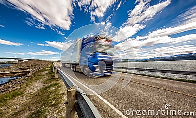 Truck rushes down the highway in the background Atlantic Ocean R Stock Photo