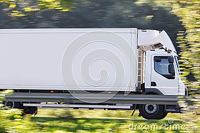 Truck speeding on highway Stock Photo