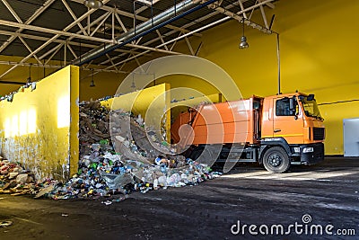 Truck throws garbage at sorting modern waste recycling processing plant. Separate and sorting garbage collection. Recycling and Stock Photo