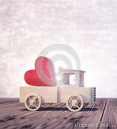 Truck toy arriving with shiny red heart Stock Photo