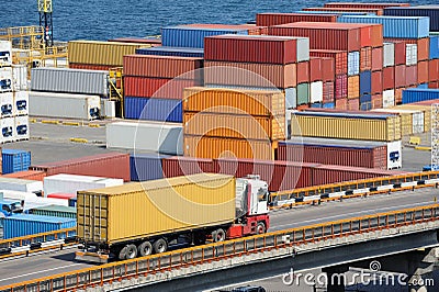 Truck transport container to warehouse near sea Stock Photo