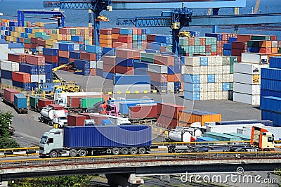 Truck transport container to warehouse near sea Stock Photo