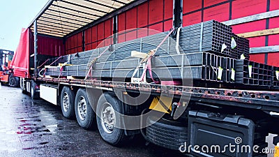 There is a loading to the truck trailer . fastening of freight in the trailer . Stock Photo