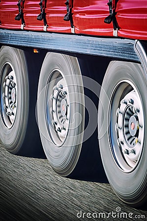 Truck wheels in motion Stock Photo