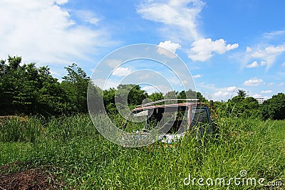 Truck wreck in the field Stock Photo