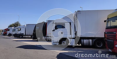 Trucks and Semi Trailer Trucks the Parking lot. Delivery Trucks. Cargo Shipping. Lorry. Industry Freight Truck Logistics Editorial Stock Photo