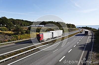Trucks and trafic on scenic highway Stock Photo