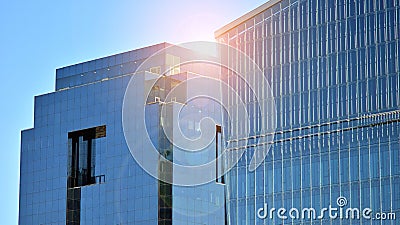 Glass building with transparent facade of the building and blue sky. Stock Photo
