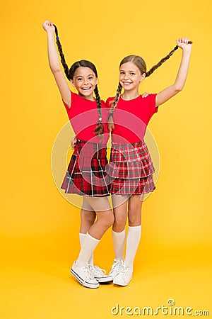 True friends. Happy small girls wearing same outfits. Friends enjoying friendship. Cheerful friends. Happy together Stock Photo