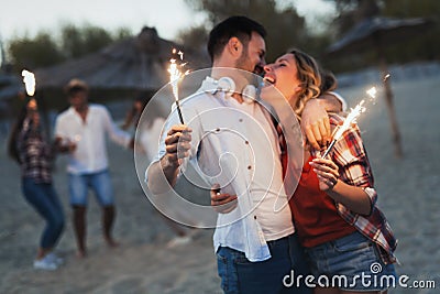 Truly happy playful couple having fun at beach Stock Photo