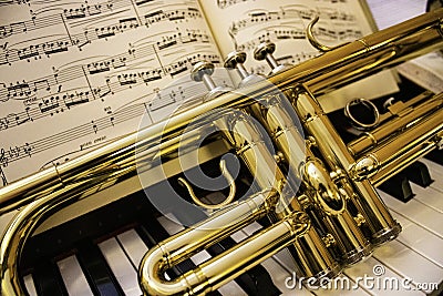 Trumpet and piano keyboard Stock Photo