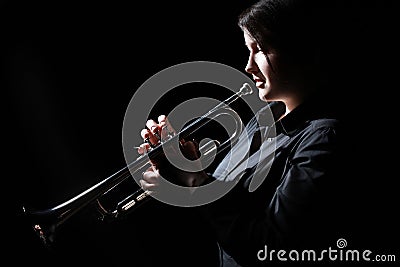 Woman trumpeter playing jazz trumpet player. Stock Photo