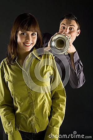 Trumpeter and beauty Stock Photo